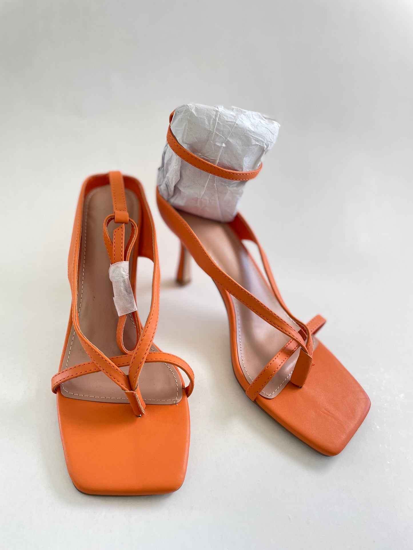 Orange strappy heels