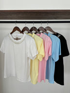 Blusa c/ collar de perlas