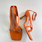 Orange strappy heels