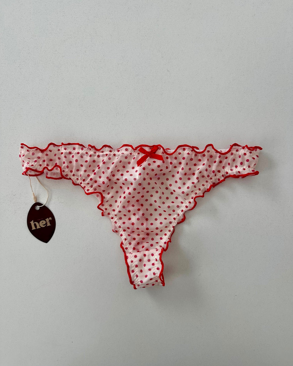 Tanga de puntos rojos