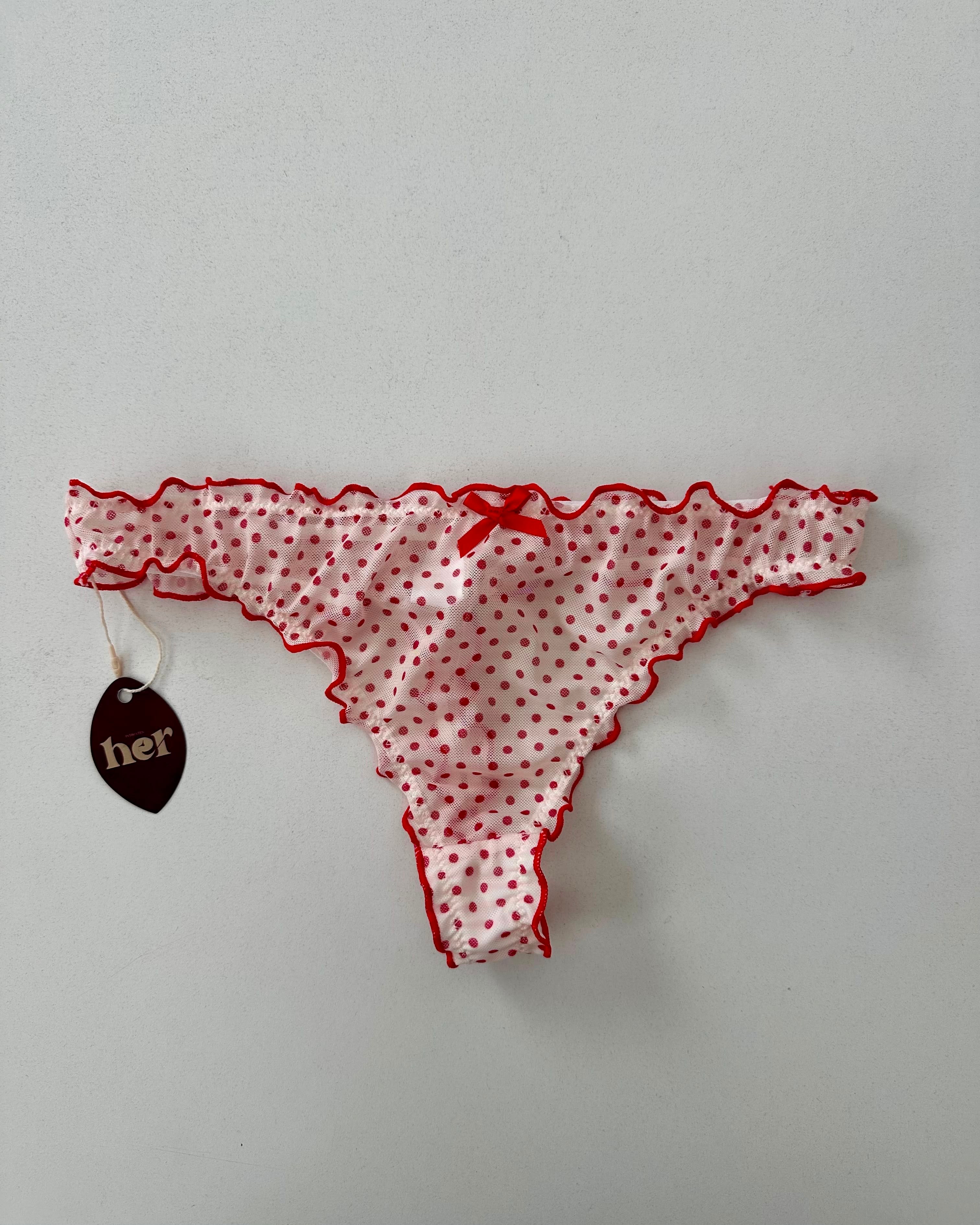 Tanga de puntos rojos