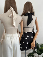 Blusa Halter satinada asimétrica