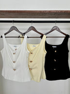 Blusa tres botones dorados