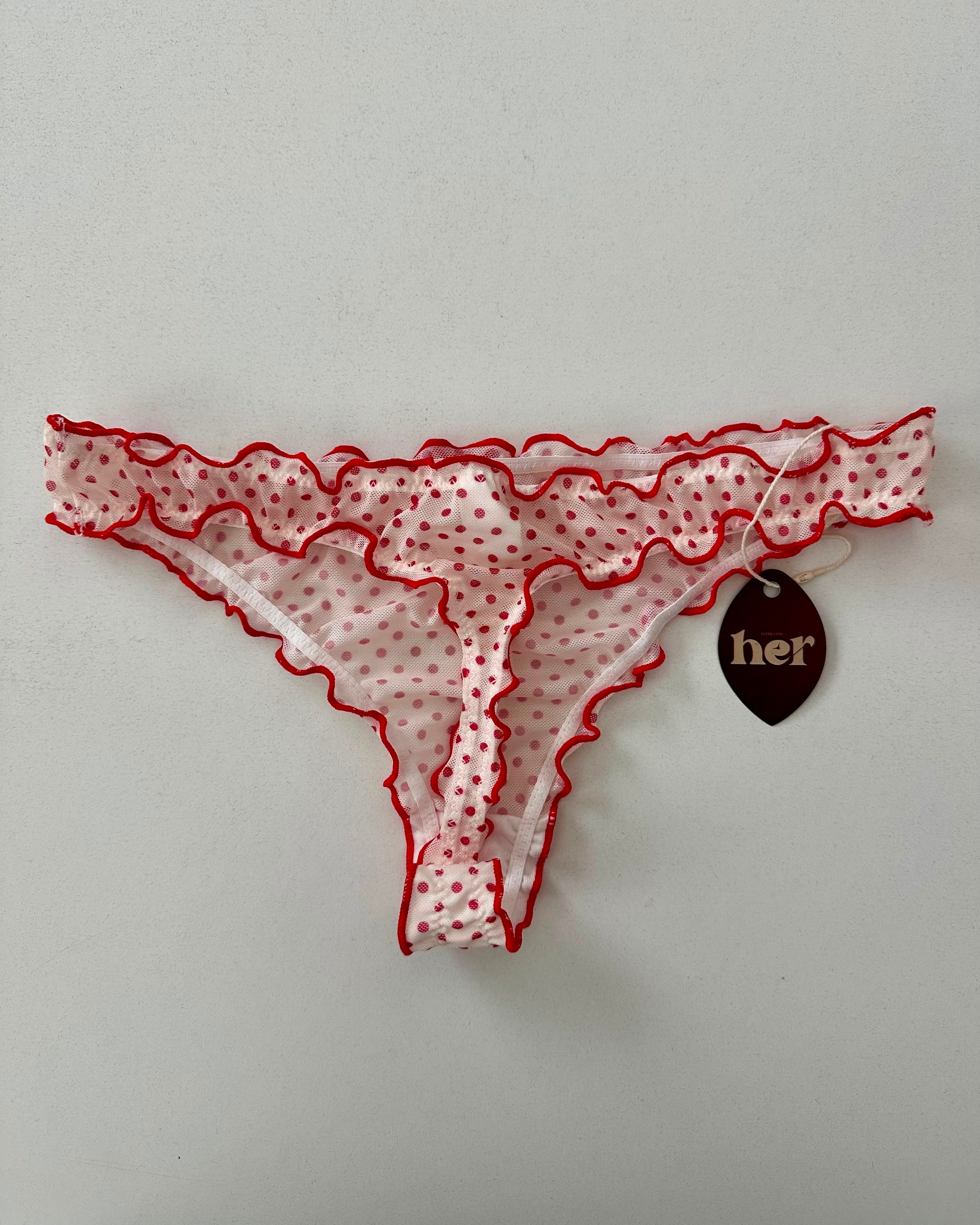 Tanga de puntos rojos