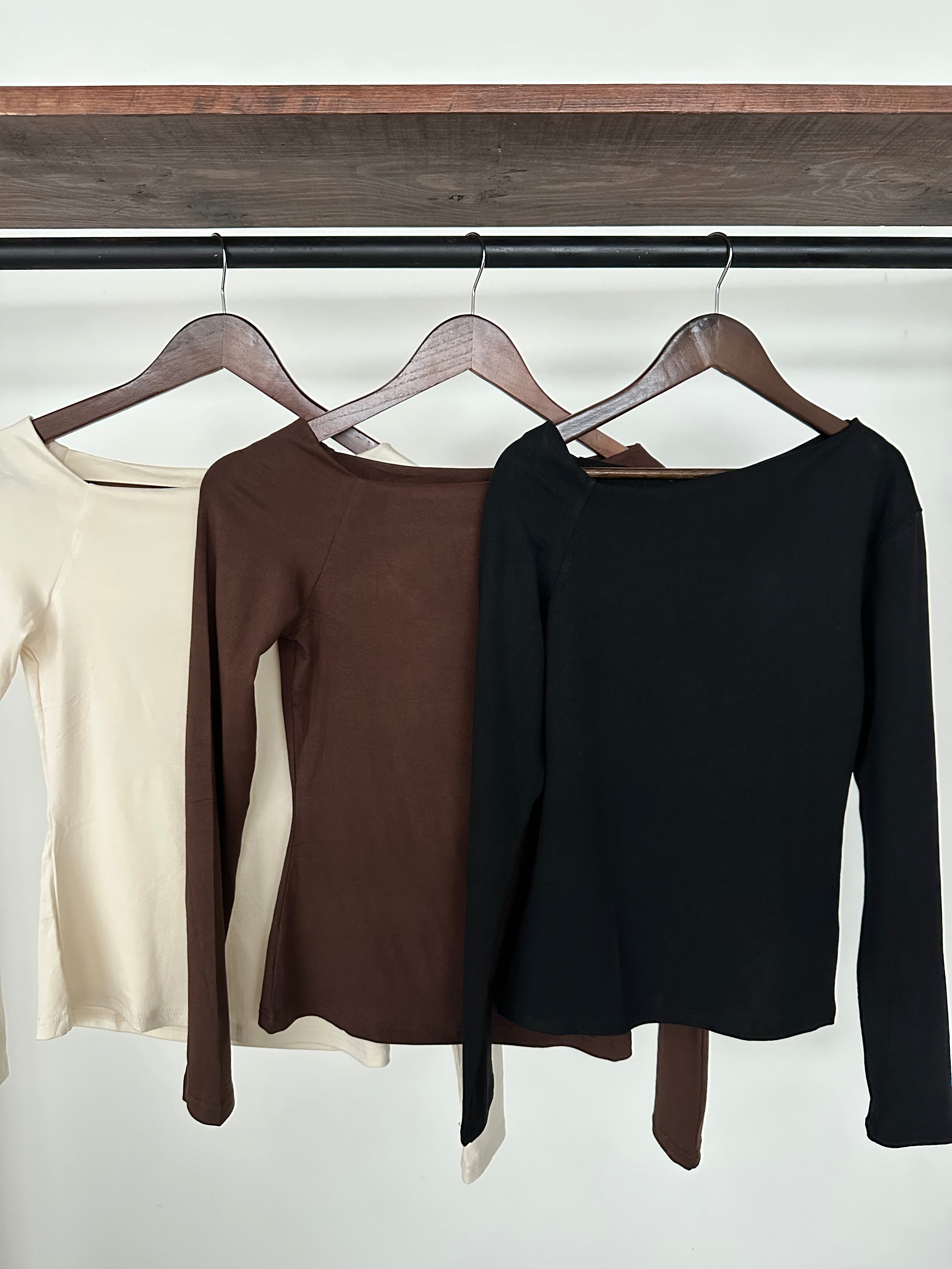 Blusa asimétrica manga larga